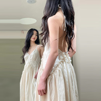 French white halterneck suspender dress for women summer 2026 new high-end backless seaside vacation long dress