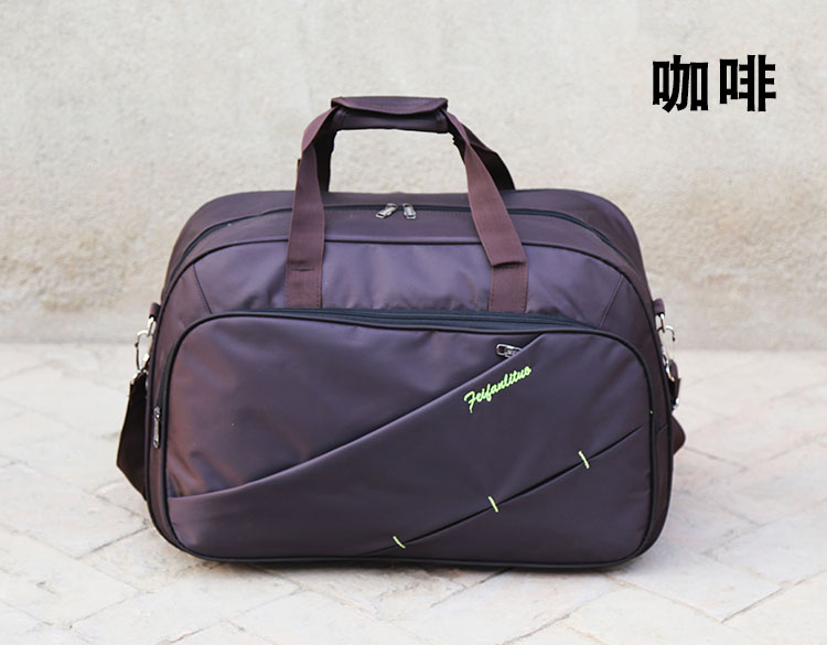 Túi du lịch di động dung lượng lớn nam và nữ túi duffel thể thao ngoài trời được sản xuất phiên bản tiếng Hàn của vai túi Messenger khoảng cách ngắn vali keo du lich