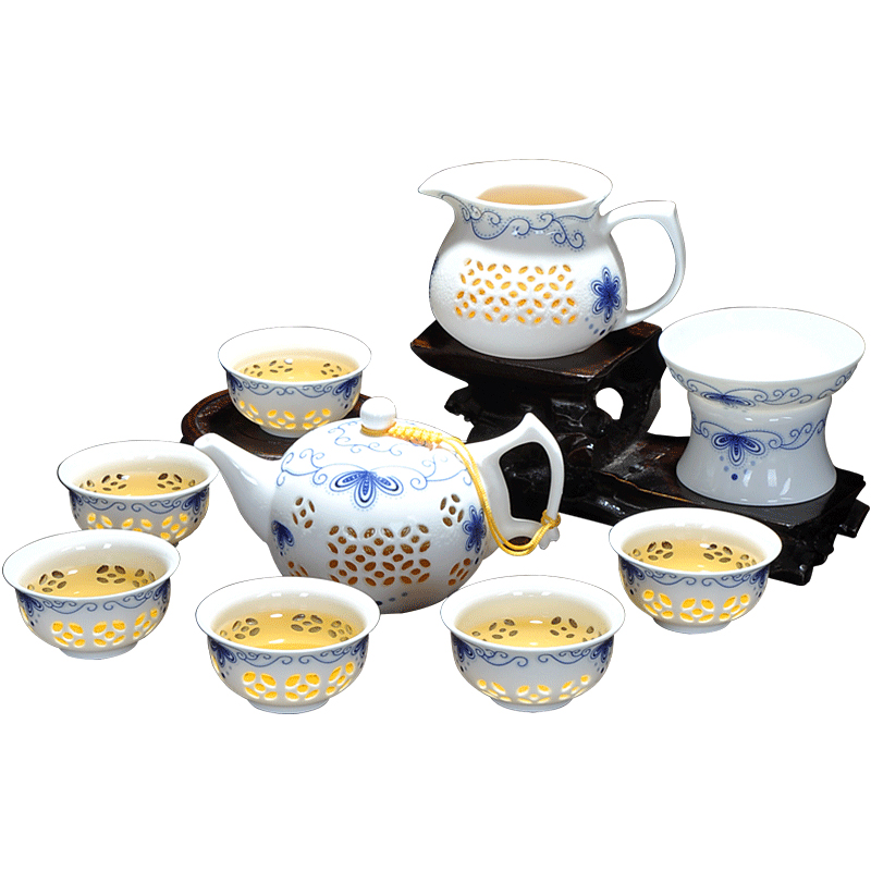 A complete set of exquisite time tea service suit hollow ceramic kung fu tea cup lid to use simple Chinese style is contracted with tea