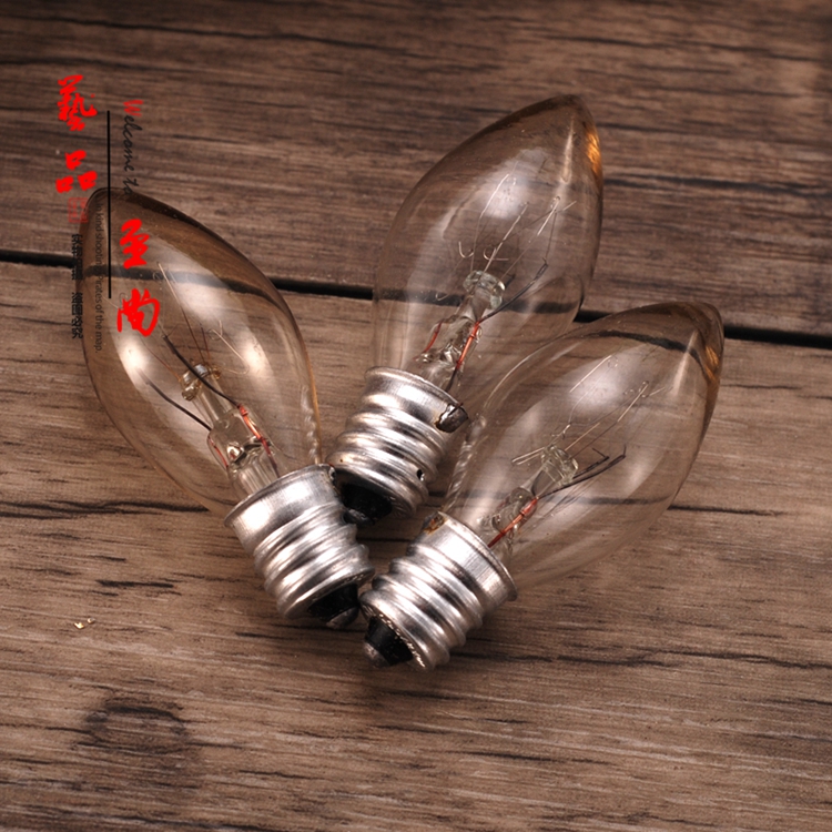 E12 small screw mouth warm light ordinary pull tail tip bulb Buddha lamp lotus bulb yellow light glass tungsten filament bulb