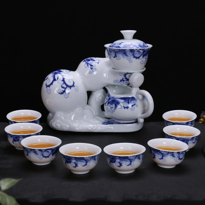 Xin arts edge of a complete set of automatic and exquisite hollow ceramic kung fu tea set suit creative hot lazy teapot
