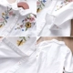 Áo bé gái thêu hoa áo sơ mi trẻ em sơ mi cotton hoang dã 2018 mùa thu quần áo trẻ em mới quần áo bé gái Áo sơ mi