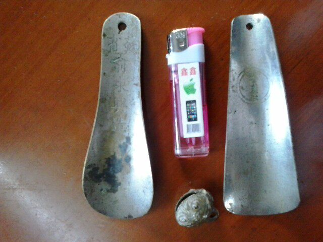 Two old bronze shoehorns (one bronze tiger bell)