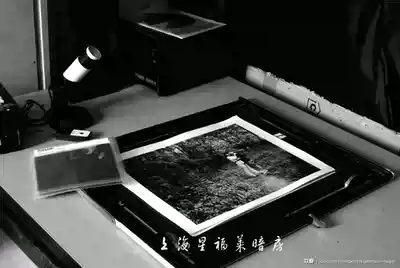 Black and white darkroom enlarged black and white photo flushing service uses ilford variable contrast plastic coated black and white photo paper