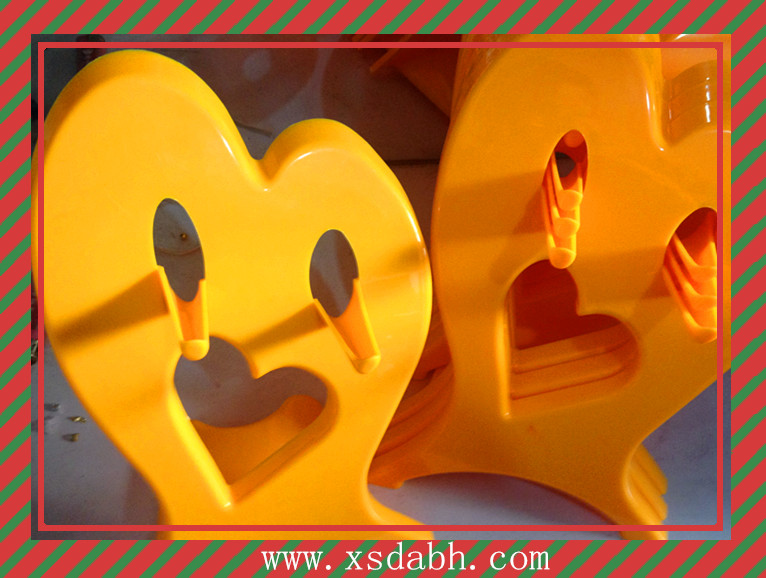 The hair dryer is stored in a shelf bracket