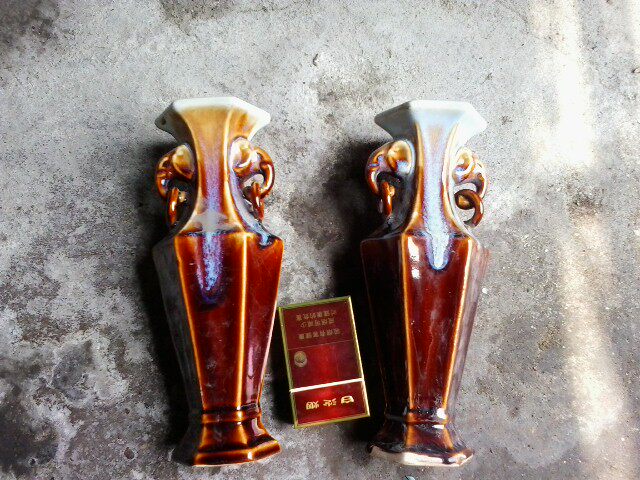 A pair of glazed ear bottles in the old Sixa Kiln