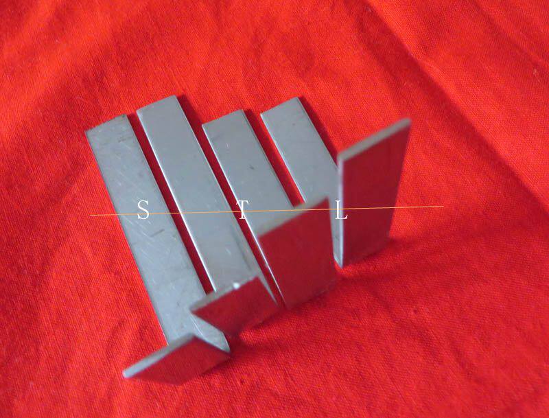 A group of 4 instrument maintenance tools vertical L iron (long flute sax clarinet adjusted tightly used)