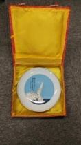 A ceramic plate commemorating the success of the first flight of the submarine-launched ballistic missile presented to the head of the Second Academy of Aerospace-Inscription by Zhang Aiping