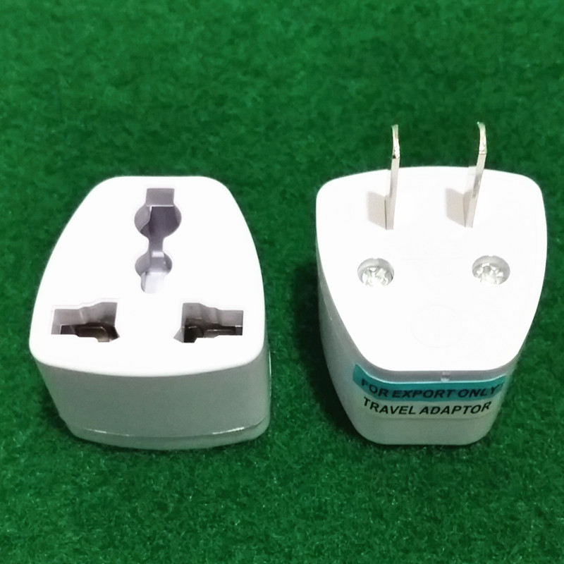 Japan's two-eye head to the National Bank two-eye converter universal travel travel socket plug British regulation American to national standard