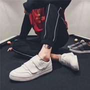 Giày nam mùa xuân thủy triều mới Giày thông thường hoang dã Giày trắng Giày sinh viên Velcro phiên bản Hàn Quốc thấp để giúp giày trắng nhỏ