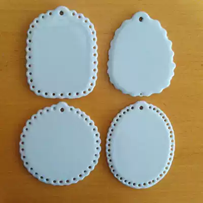 Various porcelain pendants with lace (actually not)