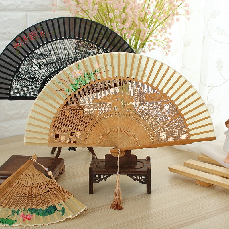 Carved fan hollow folding fan female silk fan hand-painted ancient style Hangzhou beauty gift Chinese style souvenir bamboo fan