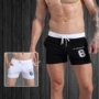 Quần thể dục thể thao Quần short nam mùa hè Mới Slim Casual Ba quần Cotton Chữ in Quần chạy bộ Quần nhà quần short nam