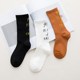 ເກົາຫຼີ Harajuku street style skateboard socks Japanese pure cotton letter mid-tube socks European and American simple long socks women's thin style