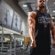 Cơ bắp thể dục thể thao không tay vest nam anh em thoáng khí thấm mồ hôi áo tập thể dục quần áo cotton lỏng