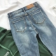 RENA Hàn Quốc bên nhỏ cắt retro đơn giản rửa nhẹ màu xanh bó sát chân đàn hồi quần denim bút chì nữ quan jean nu Quần jean