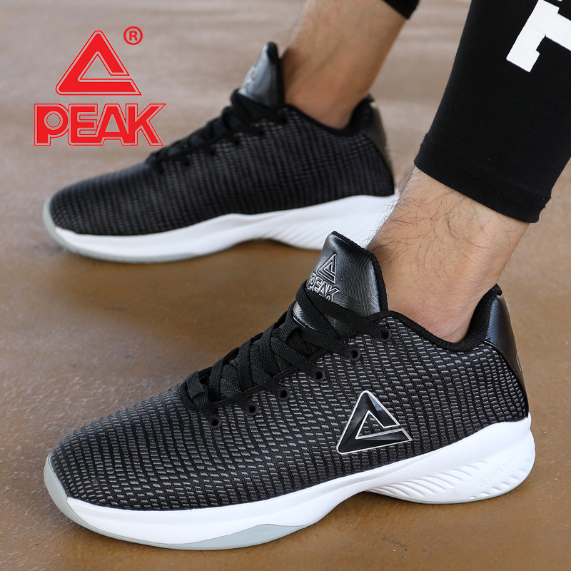 PEAK Spring New Basketball Shoes Breathable Mesh Surface Anti slip Cushioning Black and White Low Top Knitted Sports Shoes Men's Football Boot