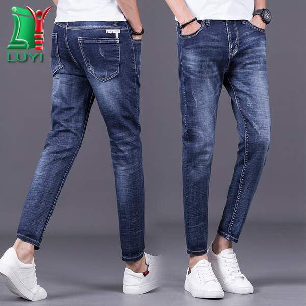 热销以纯_ 男士 潮裤 露以蓝纯色弹力牛仔裤 子