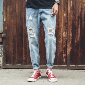 青年潮流做旧破洞小脚休闲牛仔裤